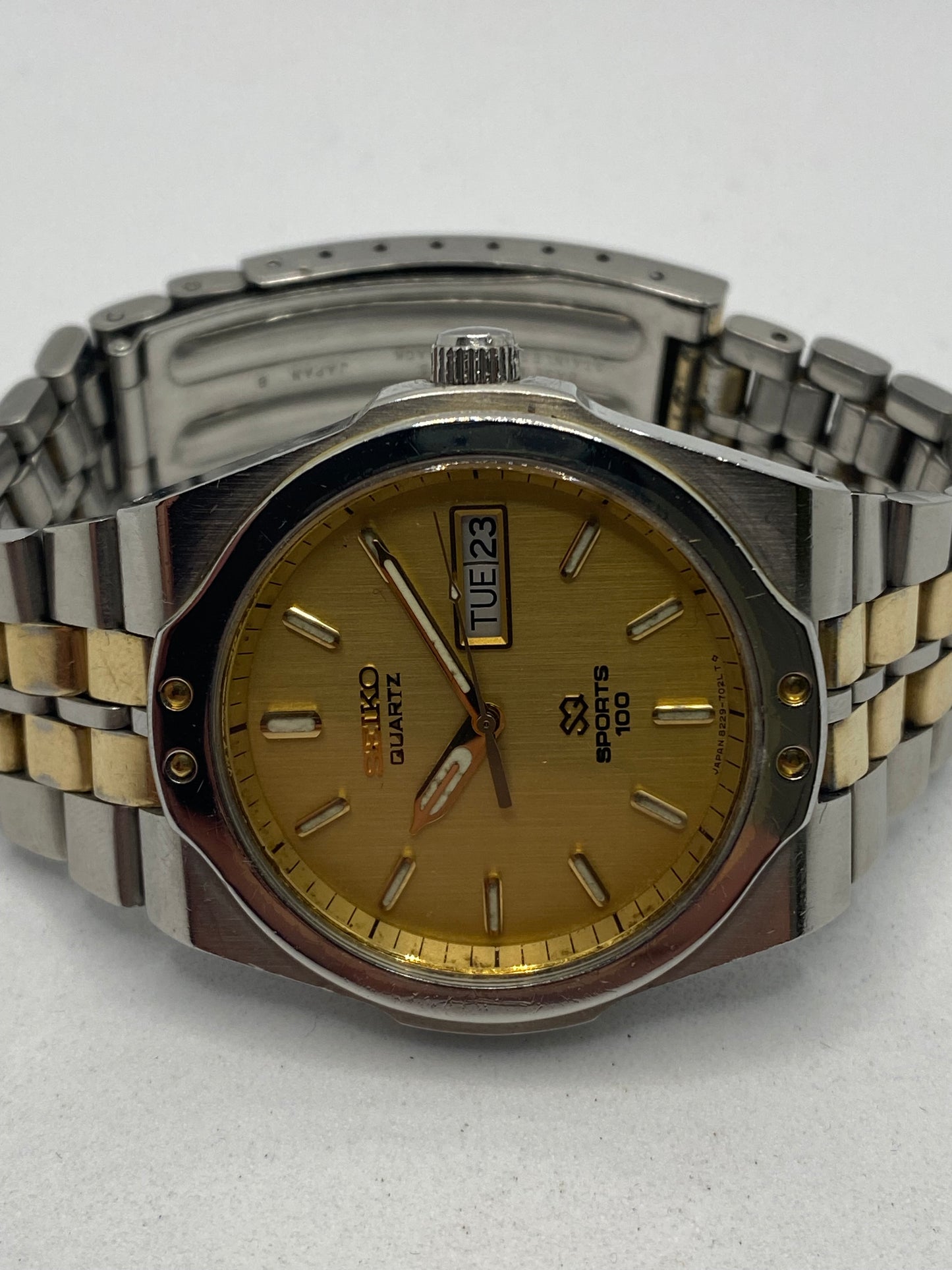 Seiko SQ Sports 100 Gold Dial Day Date Men’s Watch